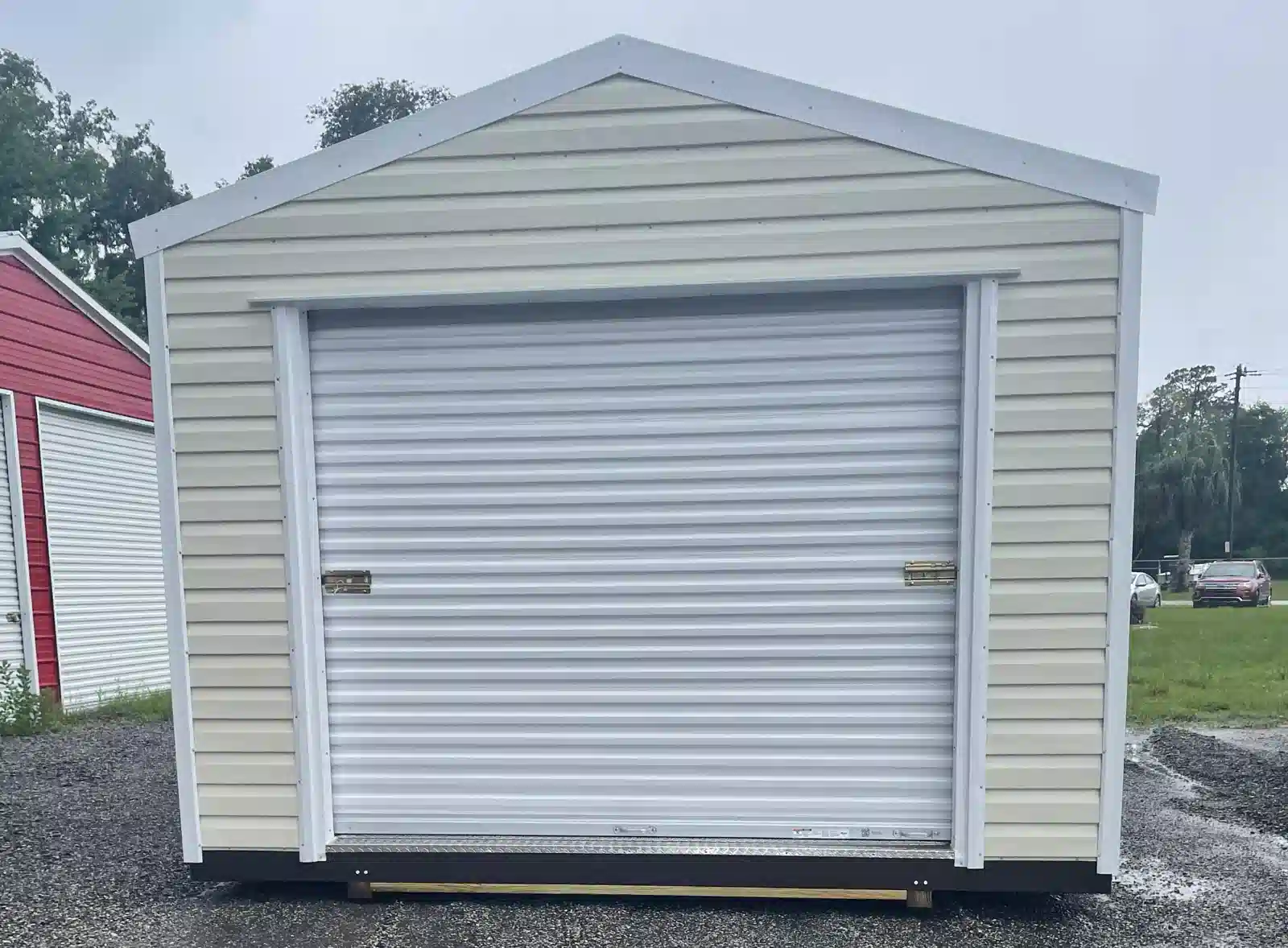 Gable-style portable storage building with lap siding and double door - Florida